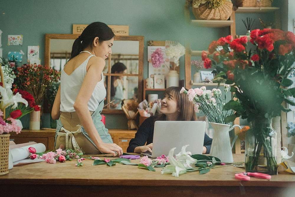 Florist arranging flowers for a social media shoot
