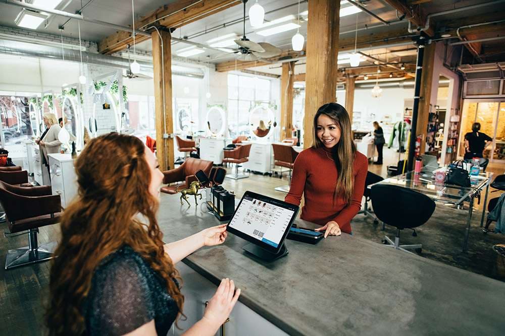 Stylist working in a hair salon during a content shoot